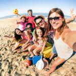 People playing at the beach. 101 NOMADS